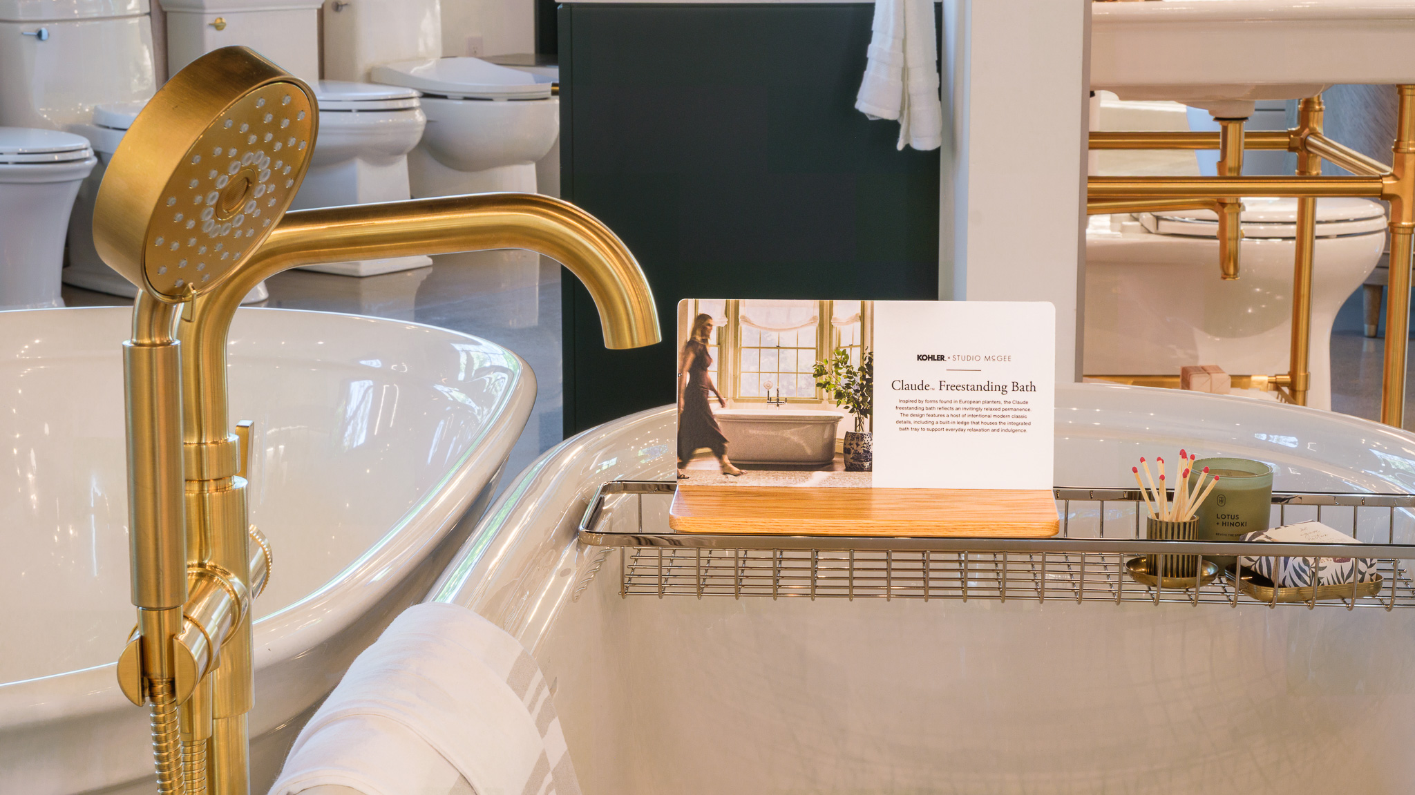 Showroom display of Studio McGee Claude bathtubs, tub filler, plumbing, bathroom, bath