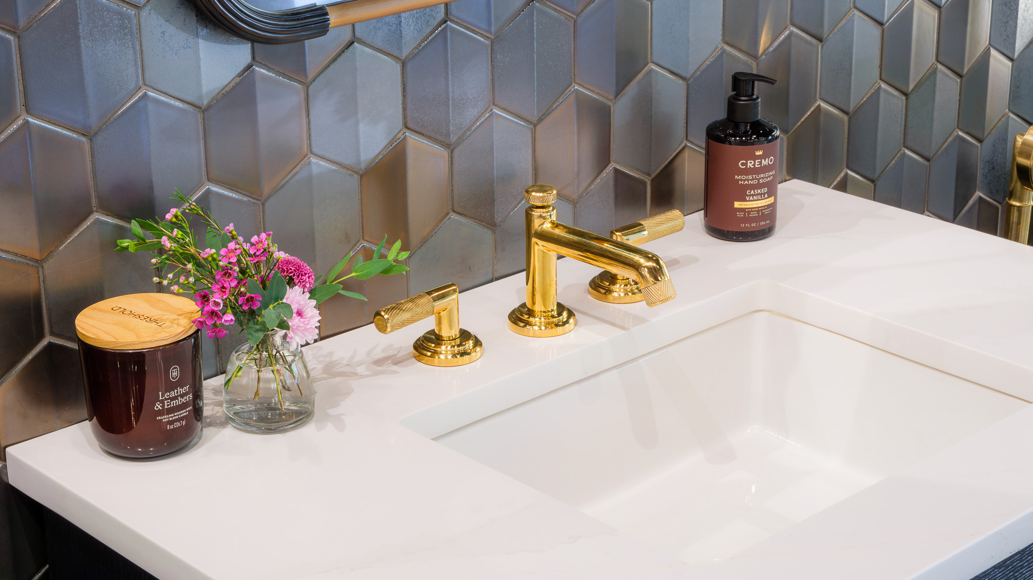 Showroom bathroom display of Kohler vanity, faucet, mirror, sink