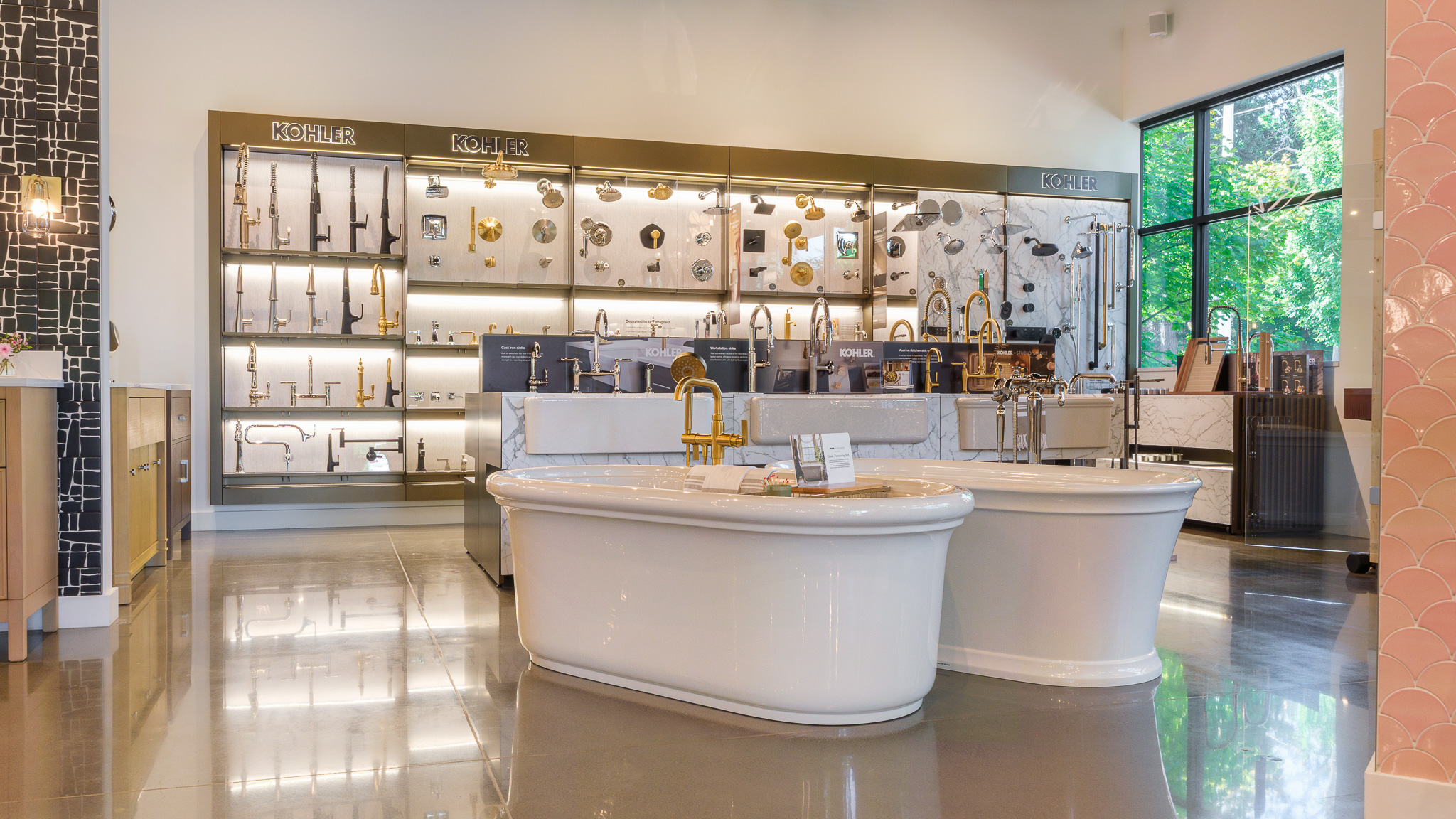 Showroom Kohler displays of kitchen, bath, bathroom, faucets, sinks, tubs, showering, handshowers, Studio McGee, Claude, and vanities