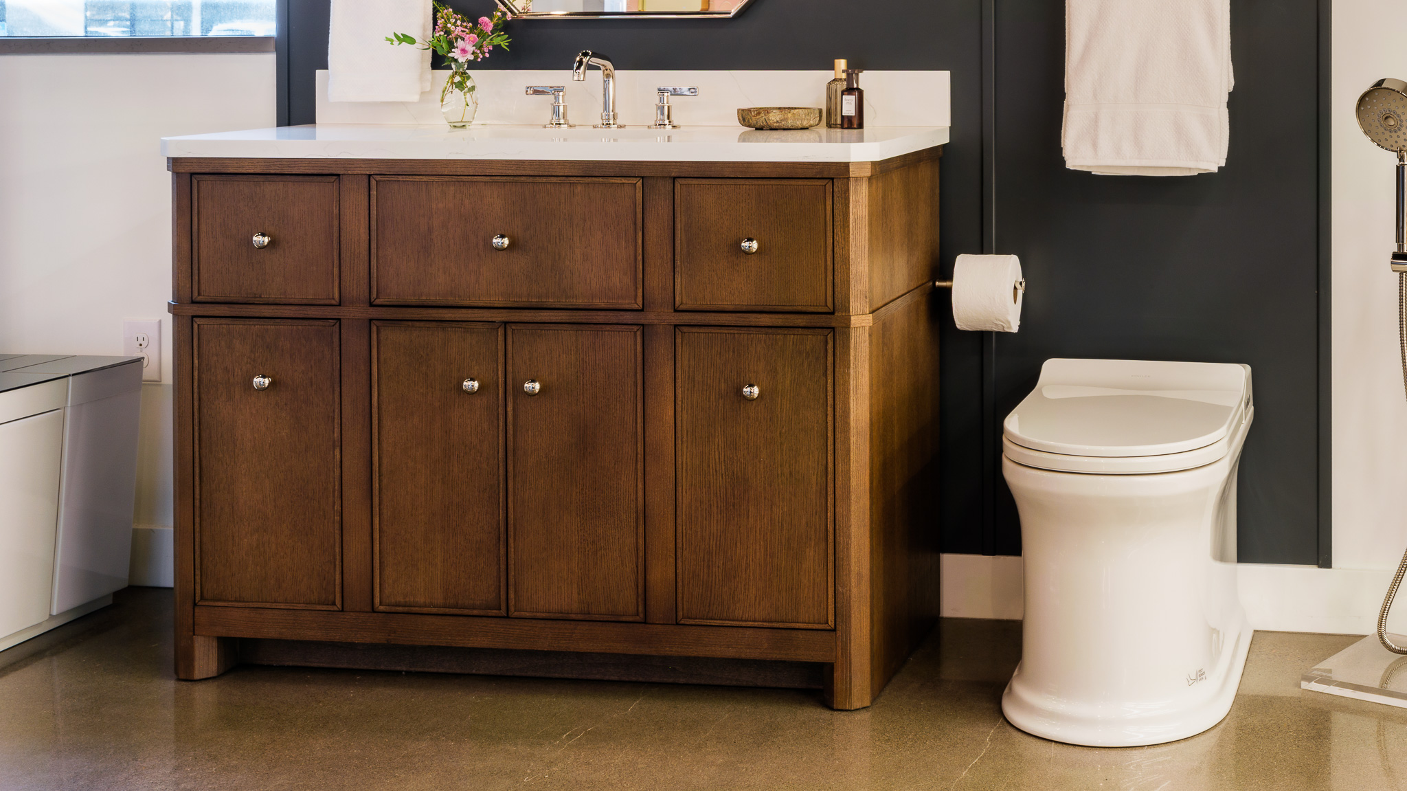 Showroom display Kohler Studio McGee bathroom vignette with vanity, faucet, Claude toilet