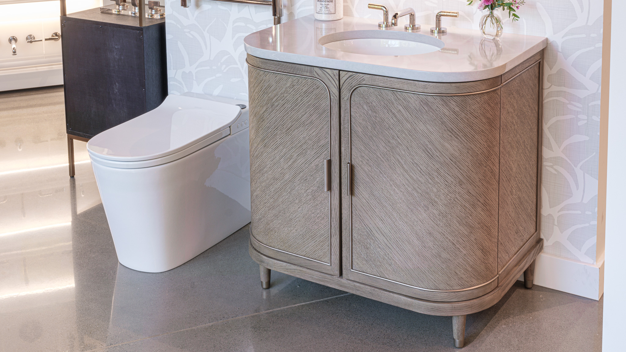 Showroom display of Kohler bathroom vanity, faucet, Leap toilet